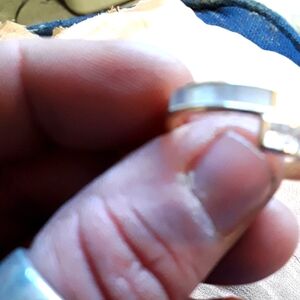 Sleek Silver Ring with Transparent Component and Internal Mechanism